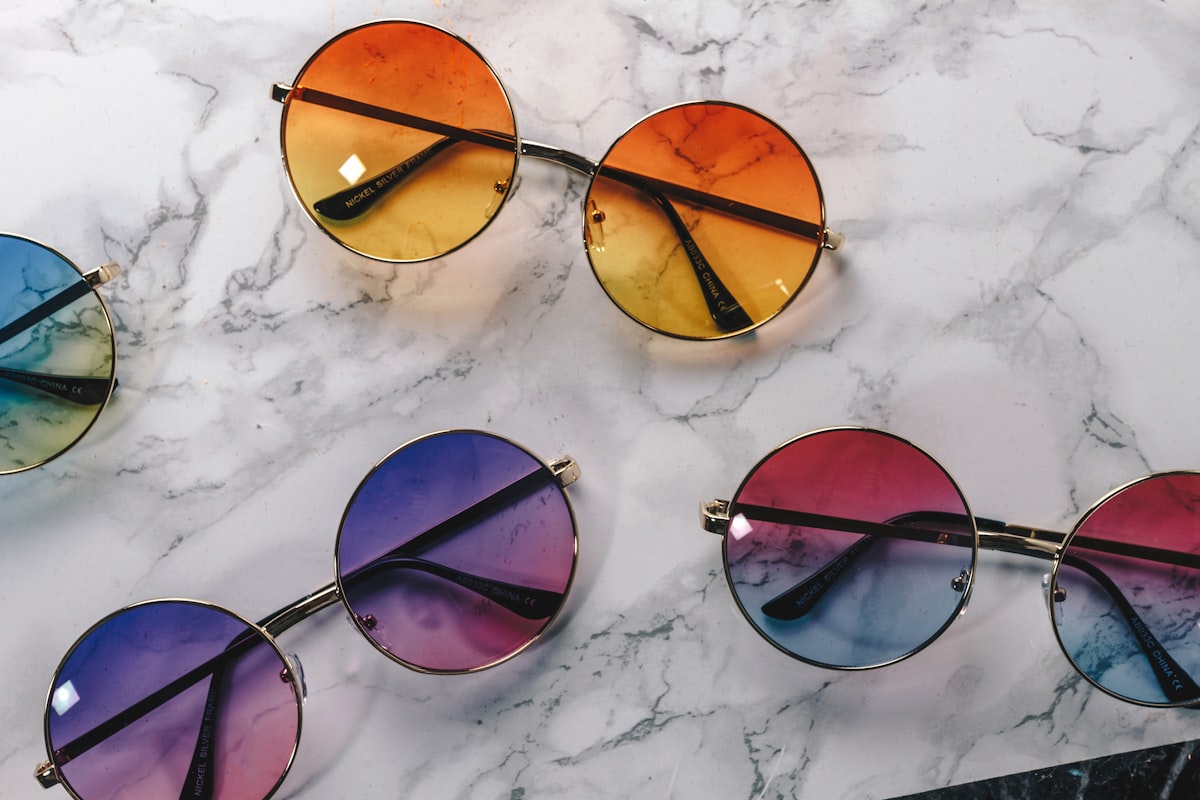 Designer eyeglass frames on display, representing service for Whitby patients